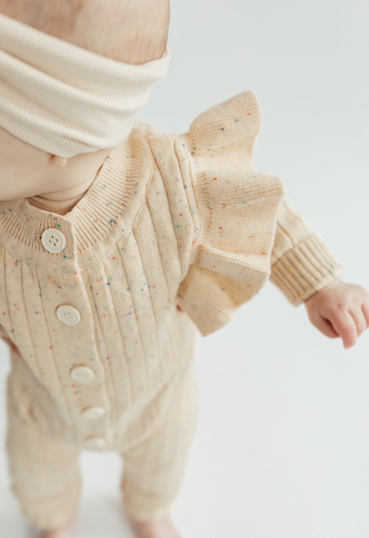 Speckles & flutters sweater romper