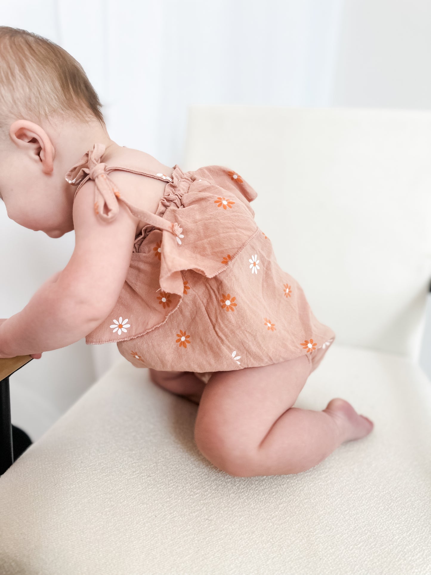 Dusted orange daisy romper