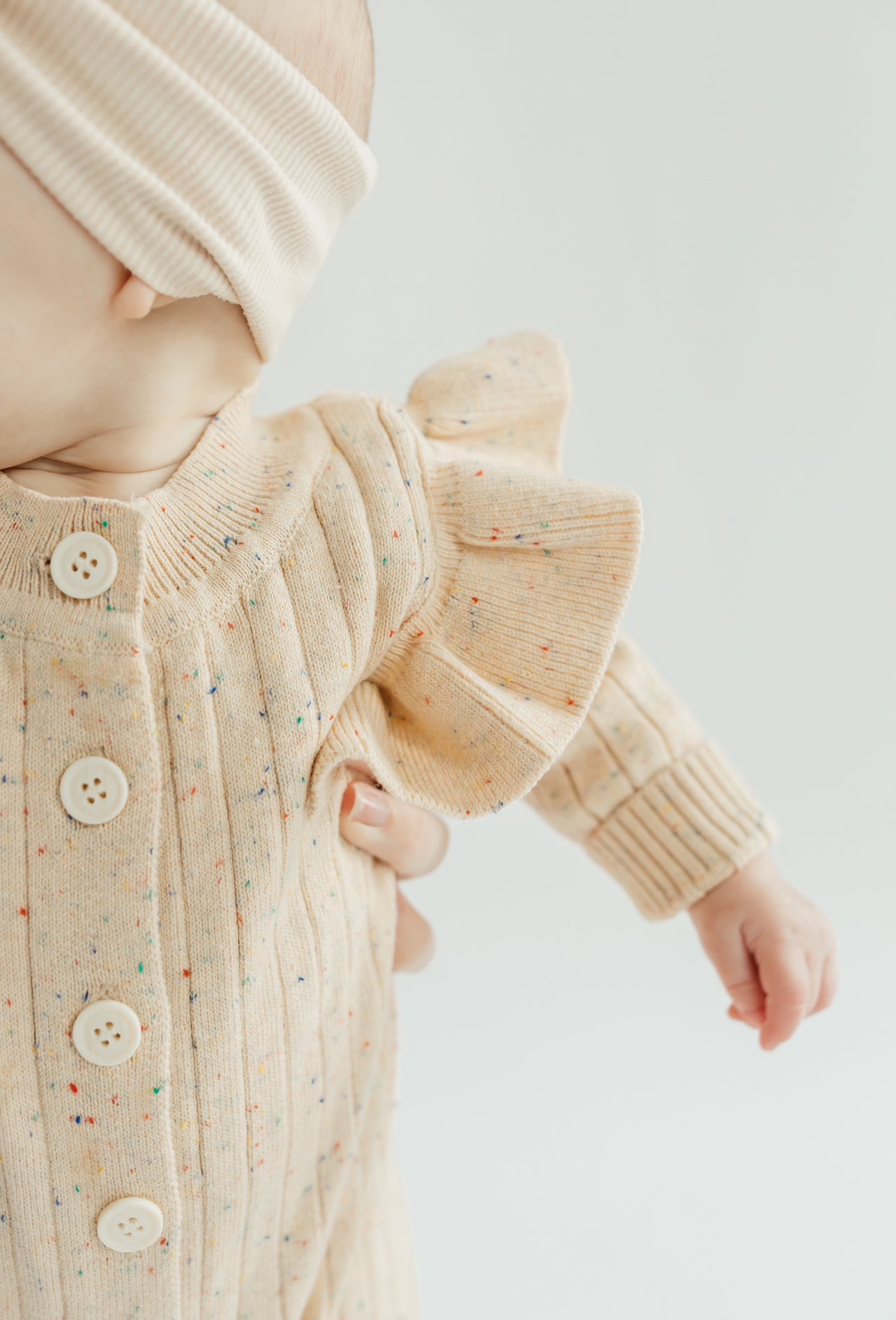 Speckles & flutters sweater romper