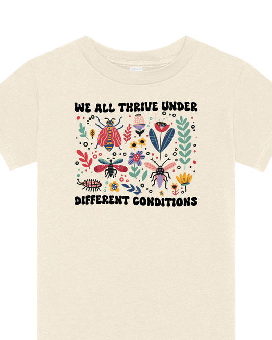 We all thrive graphic tee